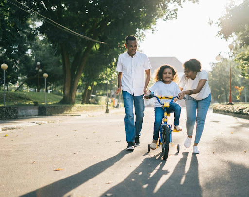 family playing in a park