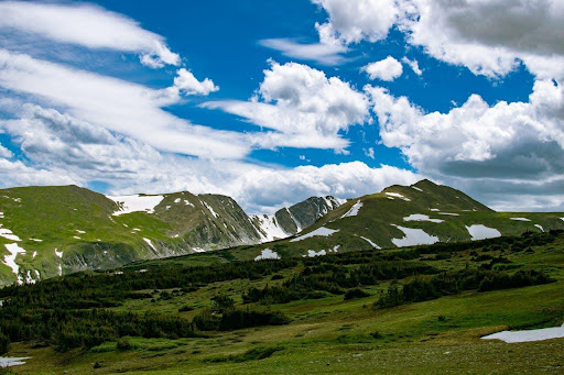 View of blue sky and green mountains 